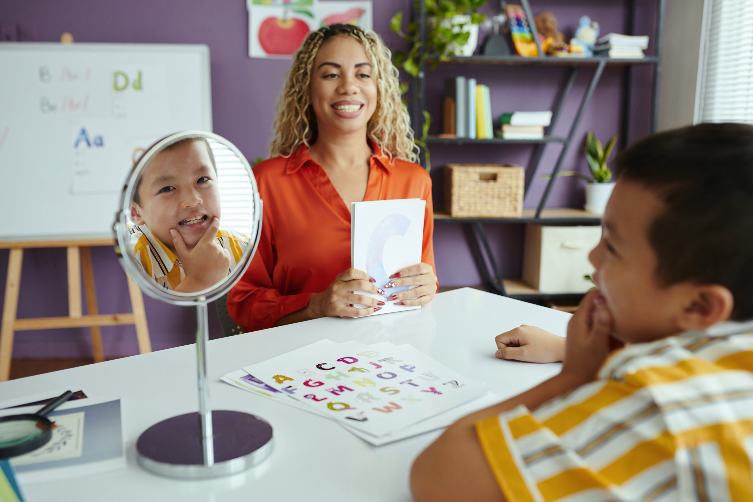 Teacher Engaging with Students in Classroom Setting